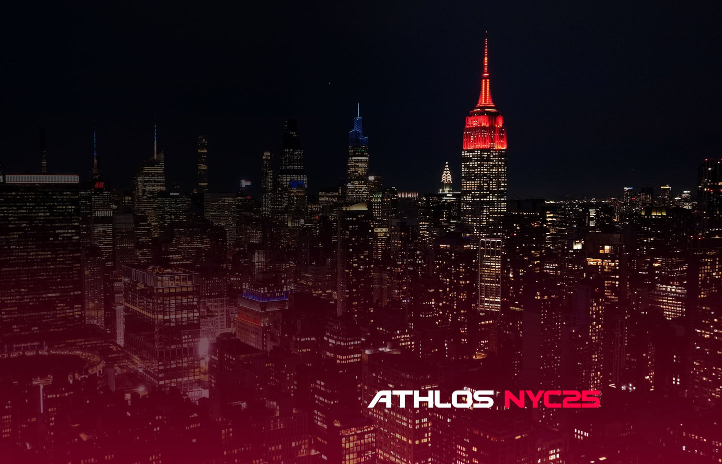City skyline at night with a prominent building illuminated, featuring 'ATHLOS NYC2S' branding.